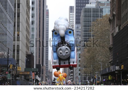 NEW YORK CITY - NOVEMBER 27 2014: the 88th annual Macy\'s Thanksgiving Day parade stretched from Manhattan\'s Upper West Side to Herald Square, viewed by 350,000 spectators.Thomas the Tank Engine