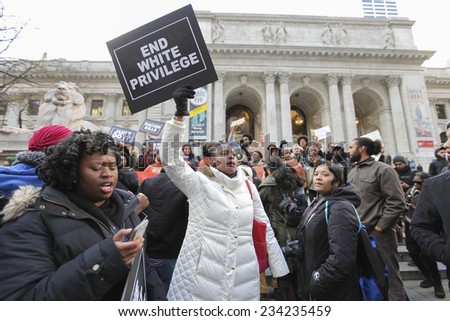 NEW YORK CITY - NOVEMBER 28 2014: several hundred activists gathered in Herald Square to urge passersby to boycott Black Friday sales at Macy\'s & other department stores in outrage over Mike Brown