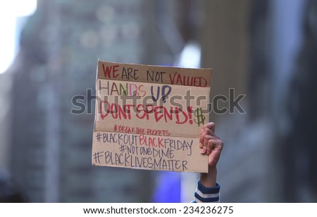 NEW YORK CITY - NOVEMBER 28 2014: several hundred activists gathered in Herald Square before marching to Times Square to protest & urge shoppers to boycott Black Friday sales in memory of Mike Brown