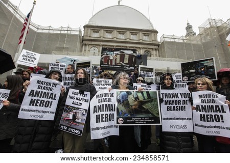NEW YORK CITY - DECEMBER 2 2014: New Yorkers for Clean & Safe Streets held a press conference by City Hall in praise of Mayor De Blasio\'s plan to ban horse-drawn carriages. NYCLASS arrayed with signs