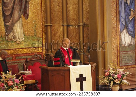 NEW YORK CITY - DECEMBER 6 2014: funeral services for Akai Gurley, shot to death by NYPD rookie officer Peter Liang, were held at Brown Baptist Church in Brooklyn. Reverend Clinton Miller