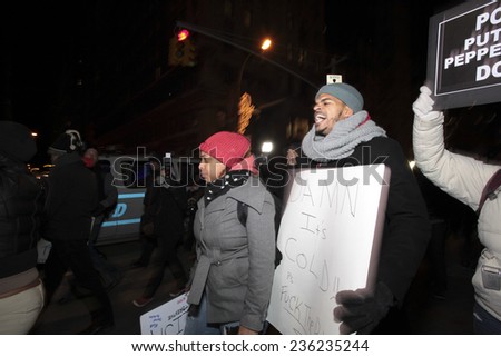 NEW YORK CITY - DECEMBER 7 2014: several hundred activists gathered at Union Square for a fifth night of marching & demonstration against a grand jury\'s failure to indict in the death of Eric Garner