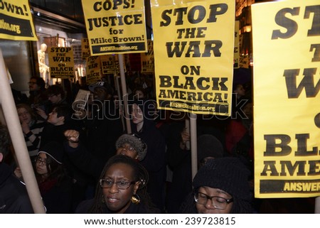 NEW YORK CITY - DECEMBER 23 2014: several hundred protesters filled Fifth Avenue to march against police brutality & holiday consumerism in defiance of Mayor De Blasio\'s call for a halt to protests