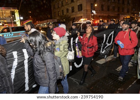 NEW YORK CITY - DECEMBER 23 2014: several hundred demonstrators gathered on Fifth Avenue for a march & protest against police brutality & lack of accountability in the death of Eric Garner & others