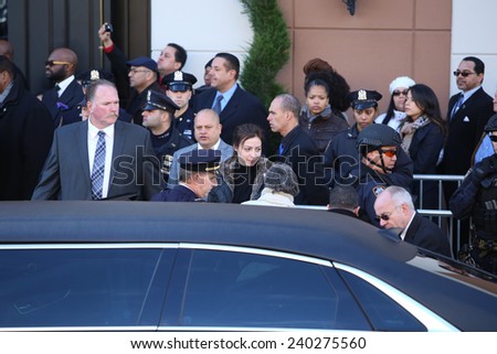 NEW YORK CITY - DECEMBER 27 2014: along with political leaders, uniformed police officers from all over north America attended funeral services for officer Rafael Ramos. Widow Maritza Gonzales Ramos