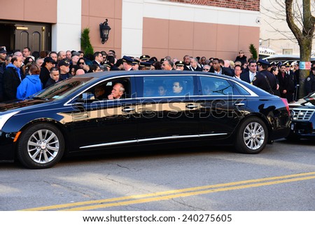 NEW YORK CITY - DECEMBER 27 2014: along with political leaders, uniformed police officers from all over north America attended funeral services for officer Rafael Ramos. Elder son Justin Ramos in car