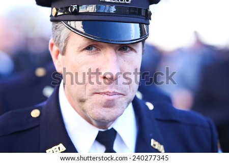 NEW YORK CITY - DECEMBER 27 2014: along with political leaders, uniformed police officers from all over north America attended funeral services for NYPD officer Rafael Ramos. PBA head Patrick Lynch
