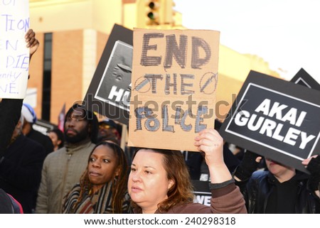 NEW YORK CITY - DECEMBER 27 2014: activists marched from the Pink Houses projects to NYPD Service Area #2 station to protest the death of Akai Gurley at the hand of NYPD officer Peter Liang