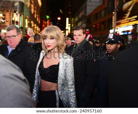 NEW YORK CITY - DECEMBER 31 2014: more than one million celebrants marked the new year in Times Square. Singer Taylor Swift arrives to perform just before midnight.