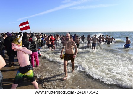 NEW YORK CITY - JANUARY 1 2014: several hundred people took part in the 9th annual Polar Bear Plunge in Coney Island, Brooklyn, to raise funds for Camp Sunshine