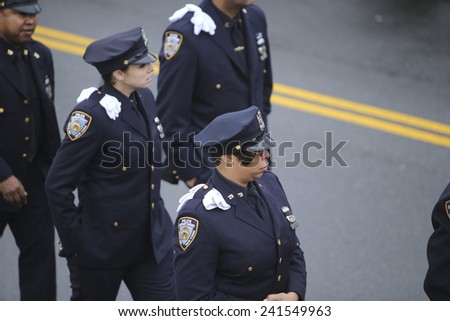 NEW YORK CITY - JANUARY 4 2015: several thousand police officers from all over North America attended funeral services for slain NYPD officer Wenjian Liu in Brooklyn