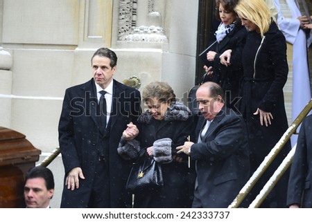 NEW YORK CITY - JANUARY 6 2015: funeral services were held for former New York governor Mario Cuomo at St. Ignatius Loyola Church on Manhattan\'s Upper East Side.Gov Cuomo escorts  mother out of church