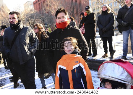 NEW YORK CITY - JANUARY 10 2015: several hundred people gathered in Washington Square Park for a moment of silence to express solidarity for the victims of the Charlie Hebdo attacks in Paris