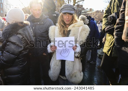 NEW YORK CITY - JANUARY 10 2015: several hundred people gathered in Washington Square Park for a moment of silence to express solidarity for the victims of the Charlie Hebdo attacks in Paris