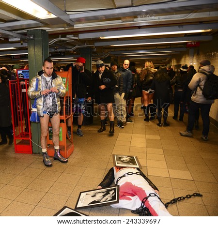 NEW YORK CITY - JANUARY 11 2015: Improv Everywhere staged its 14th annual No Pants Subway Ride bringing several hundred 