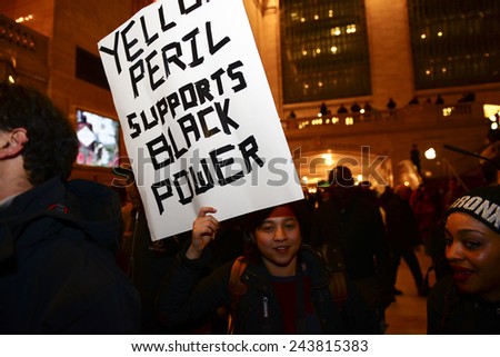 NEW YORK CITY - JANUARY 12 2015: Led by the Bronx Cop Watch, several dozen protesters gathered in Grand Central Terminal to protest against alleged acts of police brutality & lack of accountability