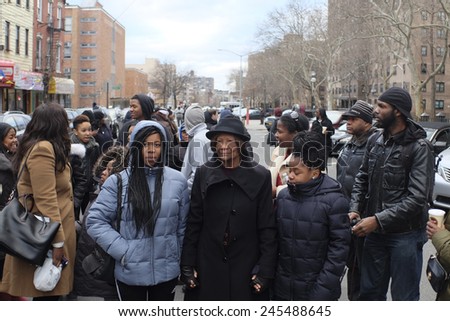 NEW YORK CITY - JANUARY 19 2015: Rev Al Sharpton, accompanied by Eric Garner\'s family, placed wreaths on the site where NYPD officers Wenjian Liu & Rafael Ramos were slain.