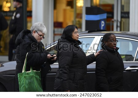NEW YORK CITY - JANUARY 25 2015: a shooting at the Home Depot store in Chelsea left two employees dead in what is being called a murder-suicide. Women present during shooting leave the scene