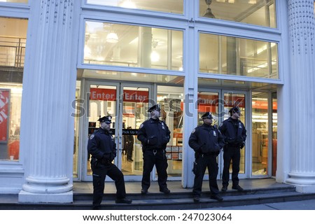 NEW YORK CITY - JANUARY 25 2015: a shooting at the Home Depot store in Chelsea left two employees dead in what is being called a murder-suicide. Uniformed NYPD officers in front of Home Depot