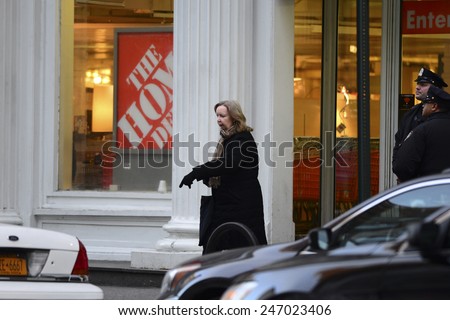 NEW YORK CITY - JANUARY 25 2015: a shooting at the Chelsea Home Depot store left two employees dead & hundreds terrorized. Woman present during shooting leaves location