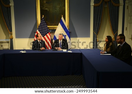 NEW YORK CITY - FEBRUARY 4 2015: Jerusalem mayor Nir Barkat, visiting NYC as part of an Israeli trade delegation, was hosted at City Hall by mayor Bill De Blasio where they held a press conference.