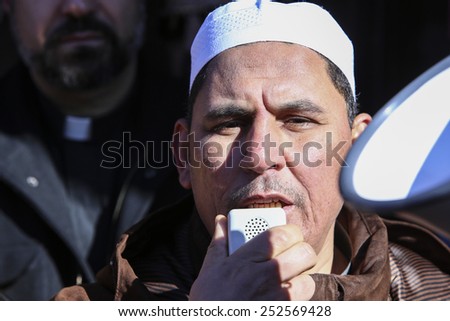 NEW YORK CITY - FEBRUARY 13 2015: Members of the Muslim community staged a vigil to call for justice in the killing of three Muslim Chapel Hill students. Muslim Imam offers benediction at rally close
