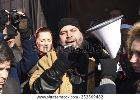 NEW YORK CITY - FEBRUARY 13 2015: Members of the Muslim community staged a vigil to call for justice in the killing of three Muslim Chapel Hill students. Organizer Zainab Khalid addresses rally
