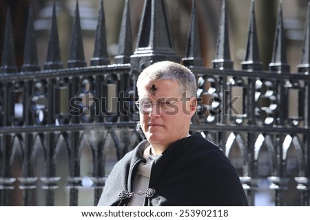 NEW YORK CITY - FEBRUARY 18 2015: Ash Wednesday was celebrated at Trinity Church with a mass by Bishop Andrew Dietsche followed by \