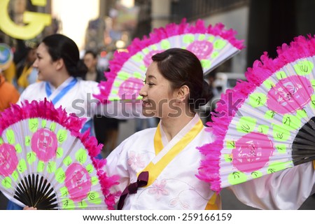 NEW YORK CITY - MARCH 8 2015: United Nations International Women\'s Day was marked with a rally in Dag Hammarskjold Plaza & march to Times Square. Women\'s International Peace Brigade with fans