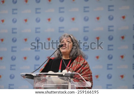 NEW YORK CITY - MARCH 8 2015: United Nations International Women\'s Day was marked with a rally in Dag Hammarskjold Plaza & march to Times Square. Native American blessing