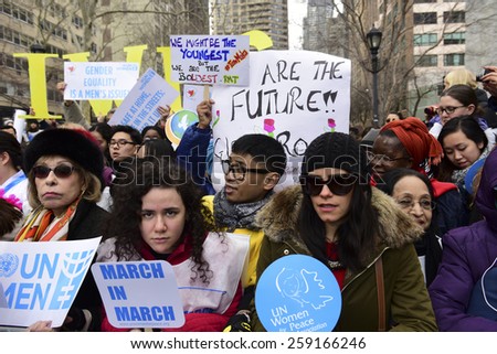 NEW YORK CITY - MARCH 8 2015: United Nations International Women\'s Day was marked with a rally in Dag Hammarskjold Plaza & march to Times Square. Marchers with signs