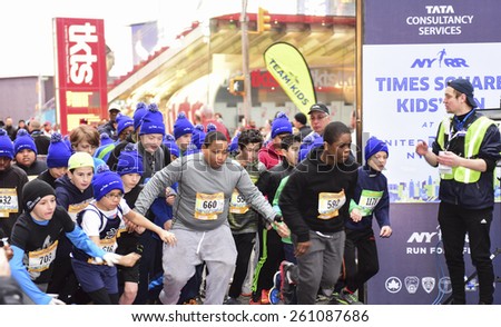 NEW YORK CITY - MARCH 15 2015: the New York Road Runners held their first ever Times Square Kids' Run a 1500 meter run coinciding with the NYRR annual Half Marathon on Seventh Avenue