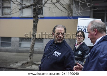 NEW YORK CITY - MARCH 26 2015: an explosion & fire thought to caused by a natural gas leak destroyed three brownstones on 7th St leaving 14 people injured & two missing. OEM head Joe Esposito