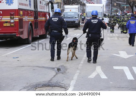 NEW YORK CITY - MARCH 27 2015: one day after a fire & explosion in Manhattan\'s East Village, two people remain missing while emergency personnel clear the wreckage of three destroyed brownstones