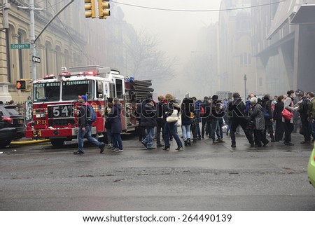 NEW YORK CITY - MARCH 26 2015: an explosion & fire thought to caused by a natural gas leak destroyed three brownstones on 7th St leaving 14 people injured & two missing.