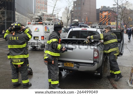 NEW YORK CITY - MARCH 26 2015: an explosion & fire on East 7th St in Manhattan\'s East Village destroyed three brownstones, left 14 people injured & two people missing. FDNY arrives on scene