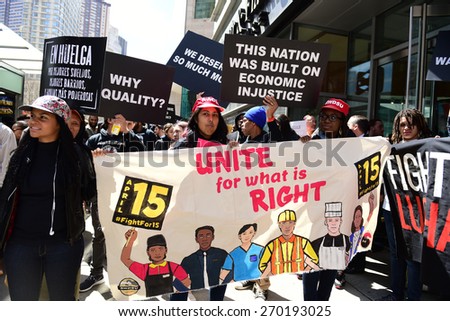 NEW YORK CITY - APRIL 15 2015: high school students, union activists & fast food workers marched in Manhattan\'s Upper West Side to demand a $15 per hour federal minimum wage.