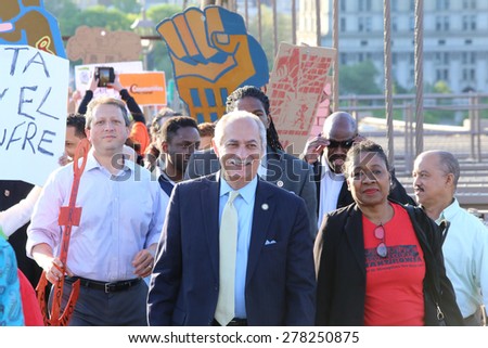 NEW YORK CITY - MAY 14 2015: several thousand tenants along with city council & state assembly members staged a march across the Brooklyn Bridge for affordable housing. Assemblyman Guillermo Linares