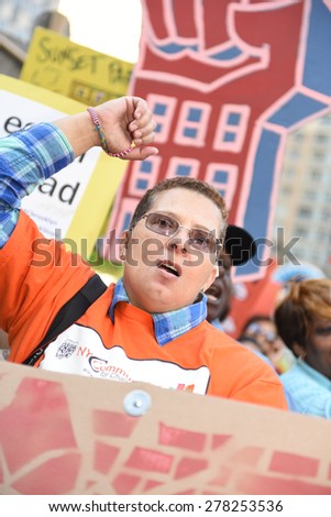 NEW YORK CITY - MAY 14 2015: several thousand tenants along with city council & state assembly members staged a march across the Brooklyn Bridge for affordable housing.
