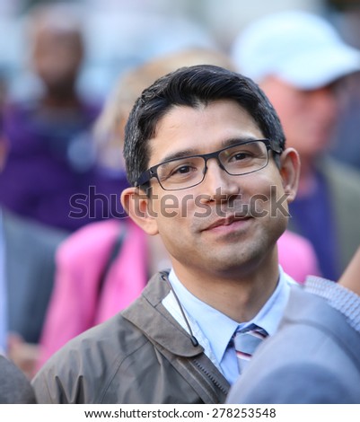NEW YORK CITY - MAY 14 2015: several thousand tenants along with city council & state assembly members staged a march across the Brooklyn Bridge for affordable housing. Council member Carlos Menchaca