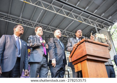 NEW YORK CITY - MAY 14 2015: several thousand tenants along with city council & state assembly members staged a march across the Brooklyn Bridge for affordable housing. NY City Council members
