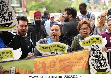 NEW YORK CITY - MAY 20 2015: labor & union activists gathered along Varick St to urge the first meeting of the NY Labor Board to set a statewide minimum wage of $15/hr.
