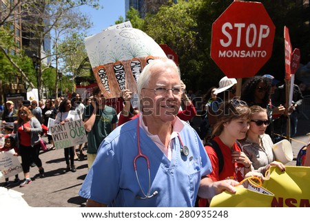 NEW YORK CITY - MAY 23 2015: environmental activists joined a global day out against Monsanto's GMO programs & demanding that foods be labeled.