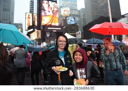 NEW YORK CITY - JUNE 1 2015: the 22nd annual Taste of Times Square brought more than 50 local restaurants & hotels together where thousands braved the rain to sample their offerings