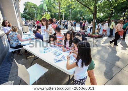 NEW YORK CITY - JUNE 9 2015: the annual Museum Mile festival brought thousands to 5th Avenue for free admission to the museums there. Kids make art of their own outside Cooper-Hewitt Institute
