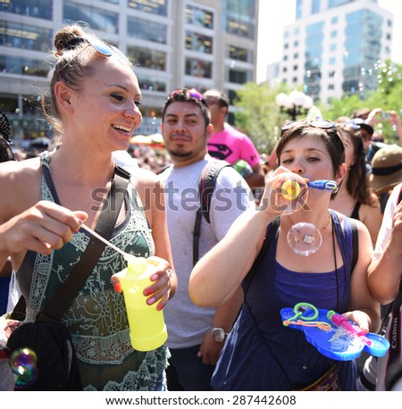 NEW YORK CITY - JUNE 13 2015: happn, sponsors of the Washington Square pillow fight, staged a bubble battle inspired by a Dr Seuss classic at Union Square Park attended by hundreds.