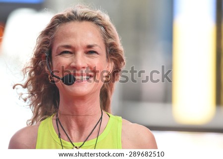 NEW YORK CITY - JUNE 22 2015: the summer solstice was celebrated in Times Square with the first International Day of Yoga, a joint effort by the United Nations & Times Square Alliance drawing hundreds