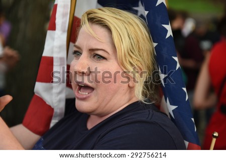 NEW YORK CITY - JULY 1 2015: dozens of military veterans, bikers, police & park service appeared at Fort Greene Park for a scheduled flag burning protest by Disarm NYPD. Scuffles ensued but no arrests