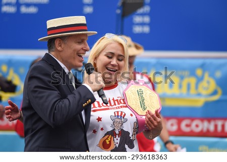 NEW YORK CITY - JULY 4 2015: Nathan\'s Famous staged its annual fourth of July hot dog eating contest in Coney Island, Brooklyn. Women\'s division champion Miki Sudo with George Shea