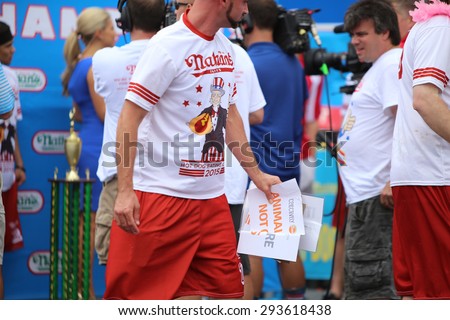 NEW YORK CITY - JULY 4 2015: Nathan\'s Famous staged its annual fourth of July hot dog eating contest in Coney Island, Brooklyn.Members of Direct Action Everywhere & Collectively Free disrupt event